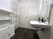 Pron�jem bytu 2+KK s balkonem a parkovac�m st�n�m ve Zb�chu.