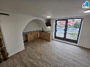 Pron�jem bytu 1+kk v obci D��ina